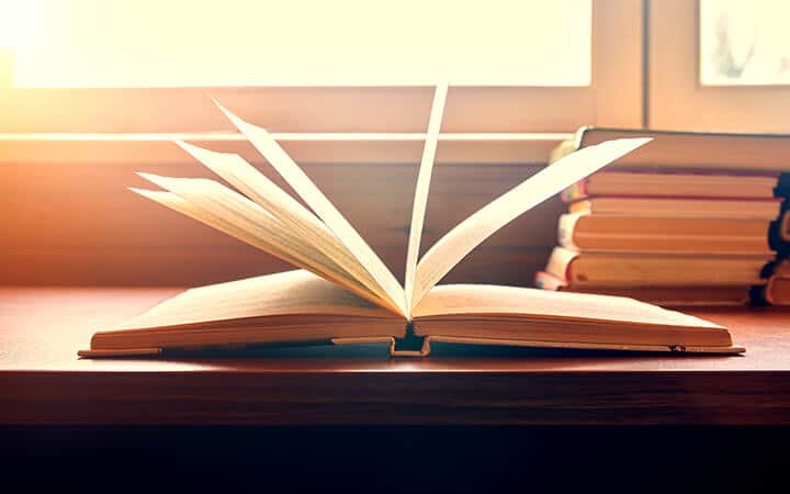 Set of books on a wooden table