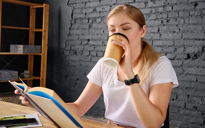 girl reading a book not of her interest to increase her knowledge and boost confidence